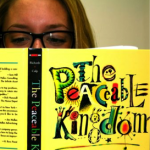 An employee reads The Peaceable Kingdom