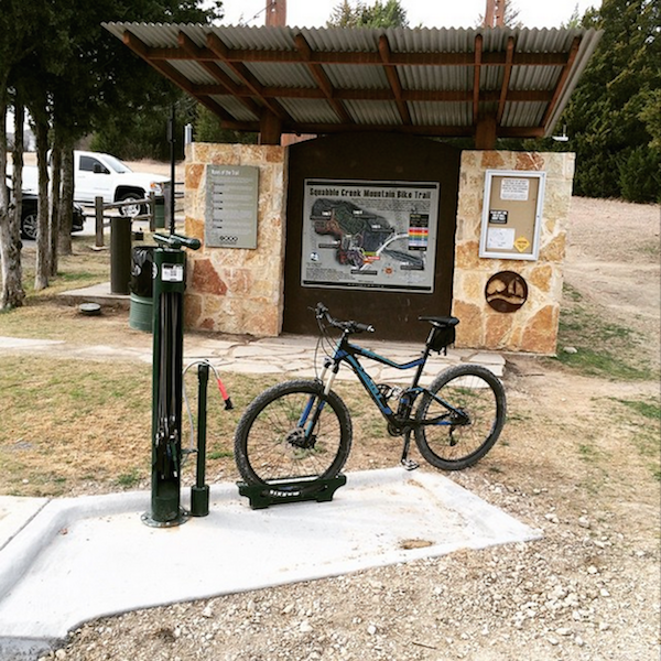 Photo of a bicycle parked at a tire filling station