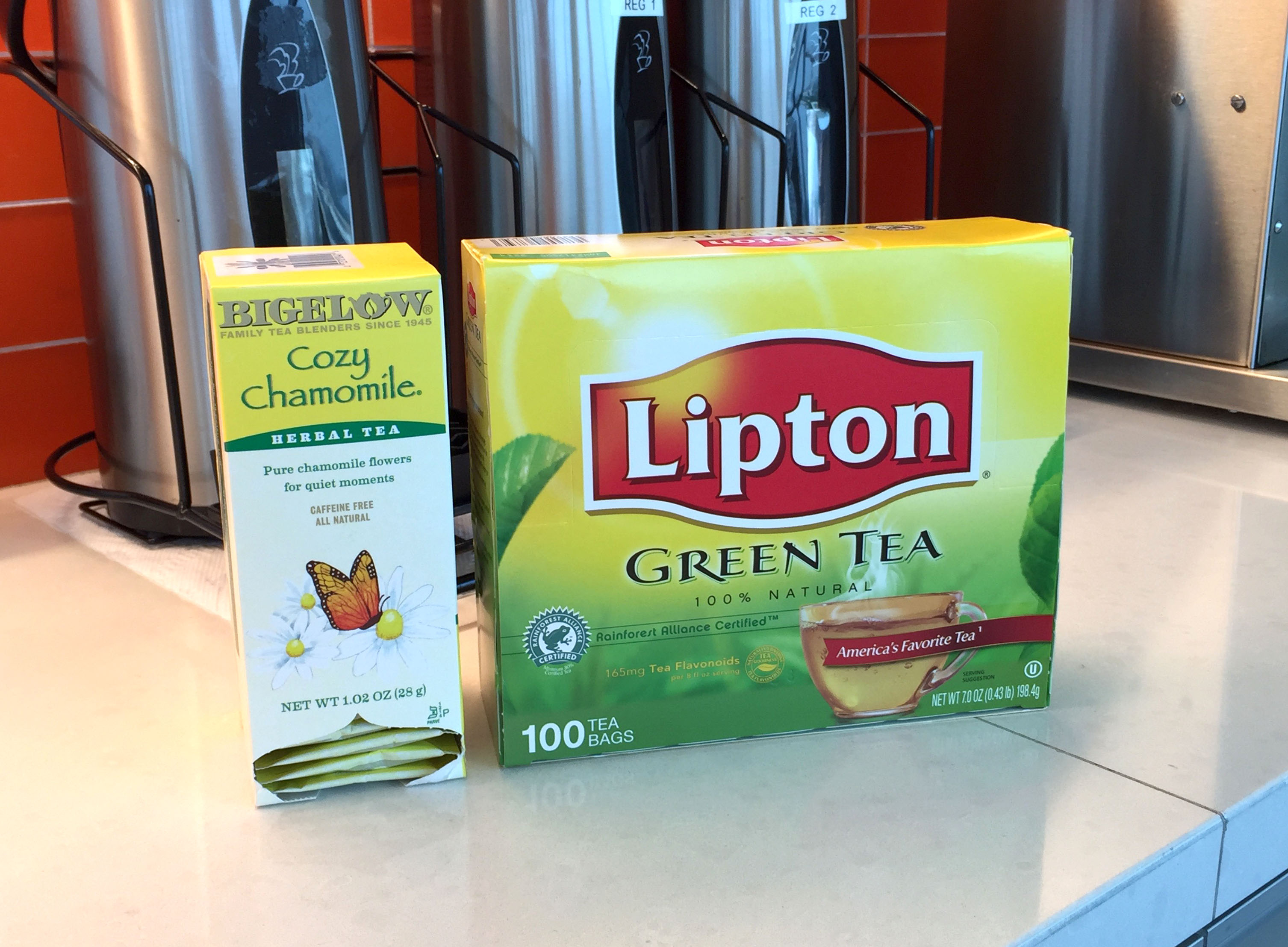 Photo showing Lipton Green Tea box and Bigelow Cozy Chamomile herbal tea in a box.