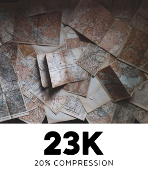 Image of piled paper maps at 23K