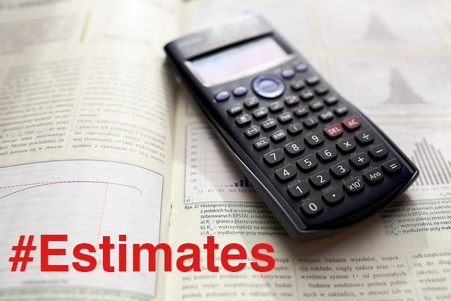 calculator sitting on open book with #Estimates hashtag